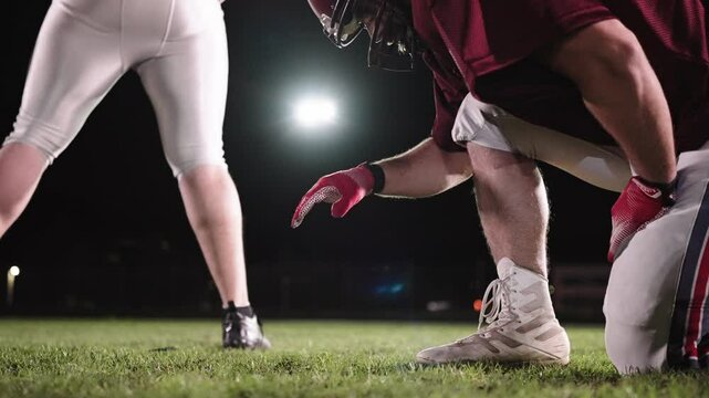 Cinematic shot of American Football player Kickoff Game Start. Static Close-up of Ball Being Kicked by the Professional Player. Gates Goal Kick. Successful Team Scores and Wins Championship.