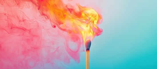 Burning match with colorful smoke on blue background.