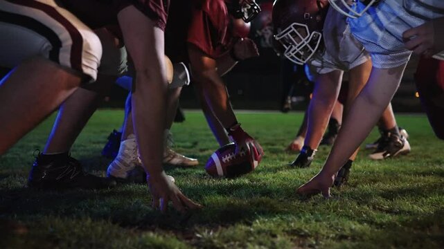 American Football Championship Start Teams Ready: Professional Players, Aggressive Face-off, Start Pushing, Tackling. Competition Full of Brutal Energy, Skill. Cinematic Slow Motion. Dramatic Sport