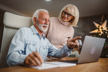 Senior wife take care of her husband while she work at home