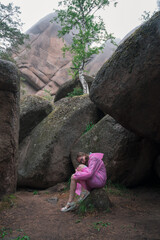 Woman in Pink Raincoat Enjoying Nature