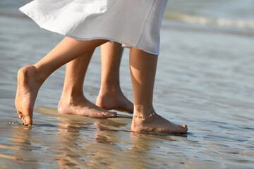 The sand on feet and heels on the coast