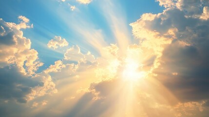 Soft beams of golden sunlight filtering through the clouds over a peaceful landscape