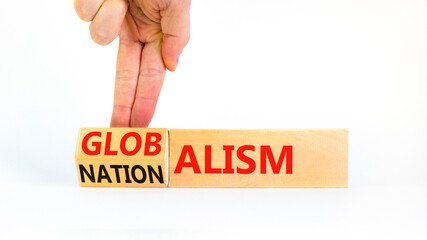 Globalism or nationalism symbol. Concept words Globalism or Nationalism on beautiful wooden blocks. Beautiful white background. Businessman hand. Business globalism or nationalism concept. Copy space