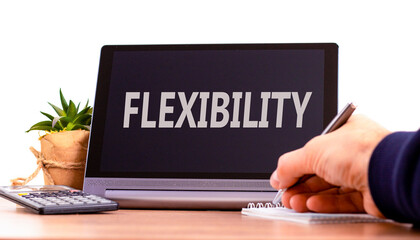 Flexibility symbol. Concept word Flexibility on beautiful black tablet. Beautiful wooden table...
