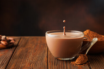 cocoa with splash and drop in cup on table