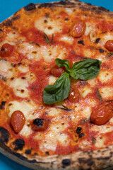 Italian pizza with basil and rosemary
