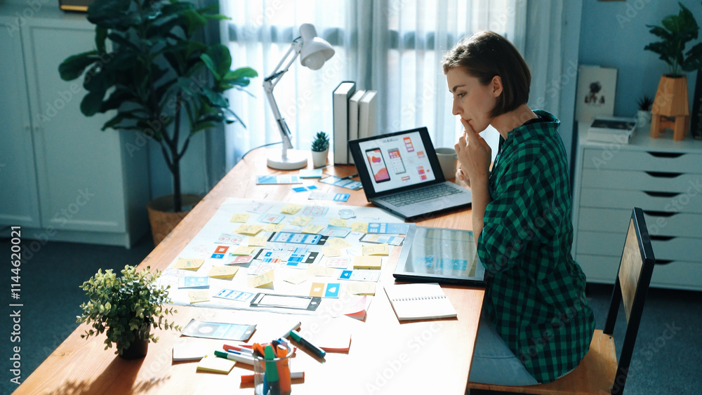 Poster top view of manager design ux, ui system while sitting at table and looking at tablet with program s