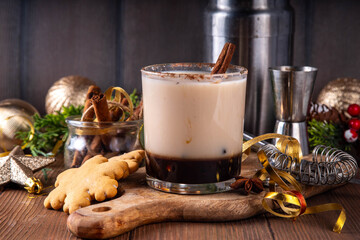 Gingerbread white russian Christmas cocktail with sweet gingerbread syrup, coffee liqueur, spices and sweet cream, in whiskey glass