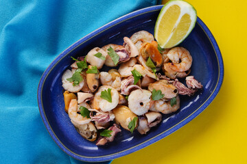 Seafood Salad featuring a mix of fresh shellfish and citrus flavors.