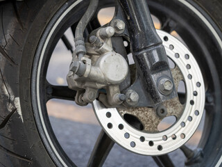 Motorcycle brake system close-up urban street mechanical eye-level engineering insight