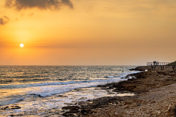 Sunset view from the coastal boardwalk near Paphos Castle, Cyprus 