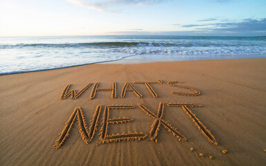 What's next? text written on beach sand. next step, path concept.
