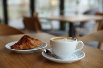 Delicious breakfast served on wooden table in cafe, closeup