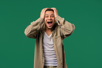 Shocked african american man glad, screaming WOW. Impressed guy, unbelievable