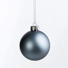 Gray Christmas ornament hangs on a thread, against an isolated white background