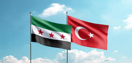 The new Syrian flag and the Turkish flag are waving in the sky