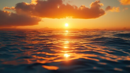 Obraz premium Tranquil sea under a vibrant sunset with soft waves and colorful clouds on the horizon