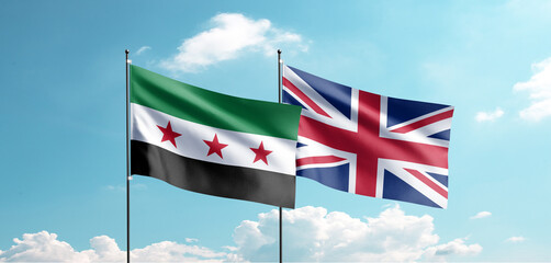 The new Syrian flag and the Great Britain flag are waving in the sky