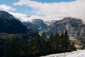 Fototapeta premium white snow on rocks in the mountains, hiking in the mountains, beautiful mountain scenery.