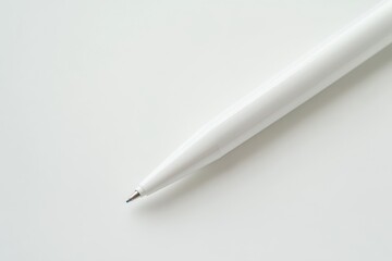 White ballpoint pen with sleek design and chrome tip, isolated on white background