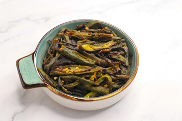 Bhindi Masala, stir-fried okra with Indian spices. Ladyfinger fry. Copy space. Bhendi ki sabzi.