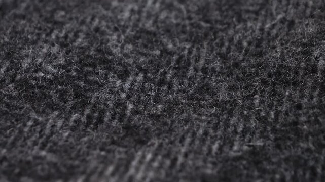 Wool textile fabric close up macro. Concept of texture and background. High quality 4k footage