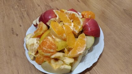 apple pie on a plate with fruit