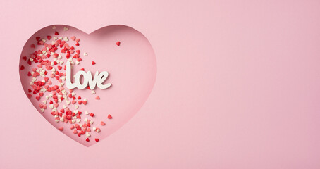 A heart-shaped decoration with tiny heart sprinkles and 