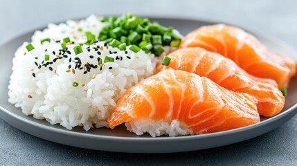 Salmon sushi with rice, sesame seeds, and green onions on a gray plate.