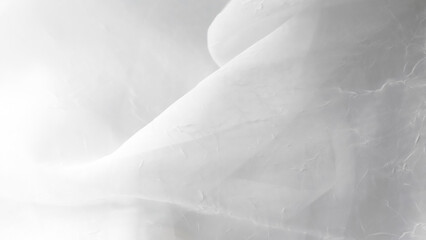 Obraz premium Elegant white veil background with fine tulle layers and soft flowing design