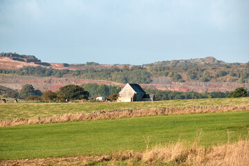 Stone farm building in a field