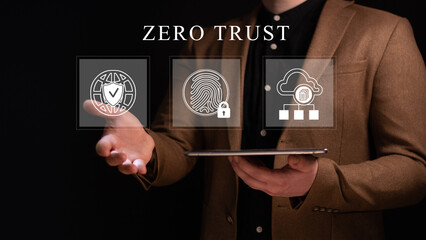 Zero trust security concept, Person using tablet with zero trust icons on virtual screen for business information security network.
