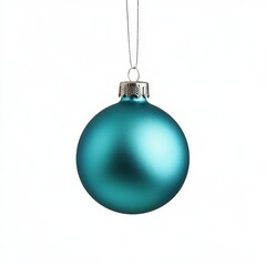 Turquoise Christmas ornament hangs on a thread, against an isolated white background