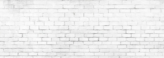 A weathered vintage white brick wall showcasing unique textures.