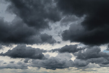 Epic Dramatic Storm sky with dark grey black cumulus rainy clouds abstract background texture, thunderstorm