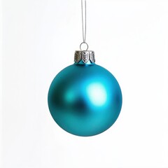 Turquoise Christmas ornament hangs on a thread, against an isolated white background
