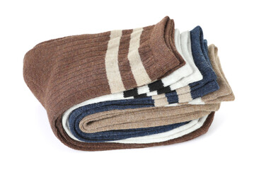 Many folded soft socks isolated on white