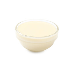 Condensed milk in bowl isolated on white