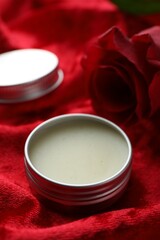 Natural solid perfume on red fabric, closeup