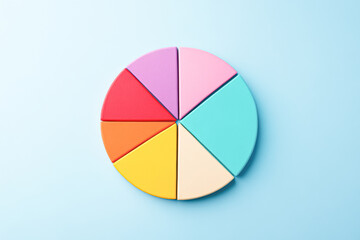 Obraz premium A colorful pie chart is shown on a blue background