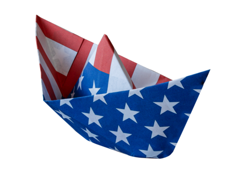 Paper boat made out of USA flag Stars and Stripes isolated on white background. Concept image.