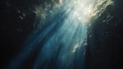 Naklejka premium Underwater light beams penetrate dark depths.