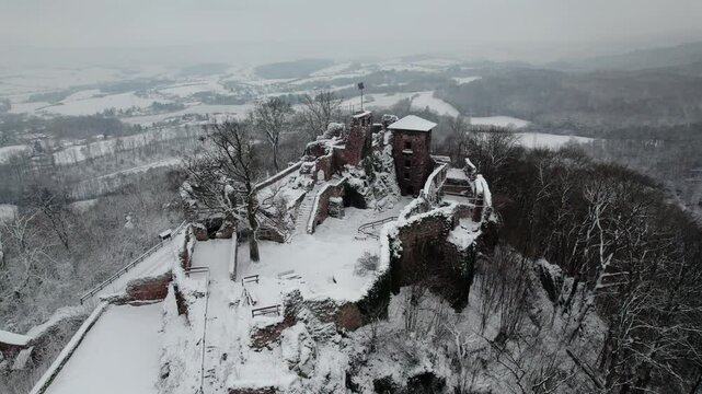 Aerial view ruins of old castle. Winter. Ruin of Hohnstein Castle, Harz mountains, Germany.