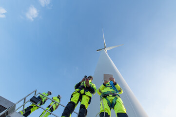Wind Turbine Maintenance and Repair Technician, Engineer Checking Turbines working maintenance clean power generator system