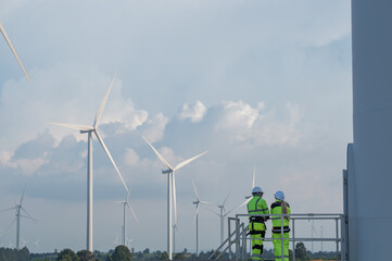 Wind Turbine Maintenance and Repair Technician, Engineer Checking Turbines working maintenance clean power generator system