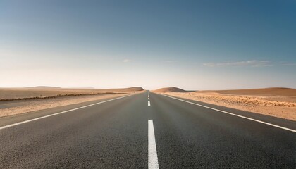 A straight road through a desert landscape.