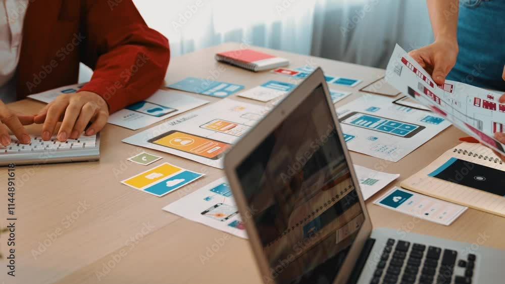 Poster panorama video of startup company employee planning on user interface prototype for mobile applicati
