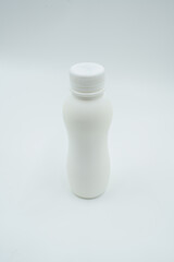 plain white plastic bottle with screw cap on light background
