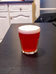 glass of fruit beer on table